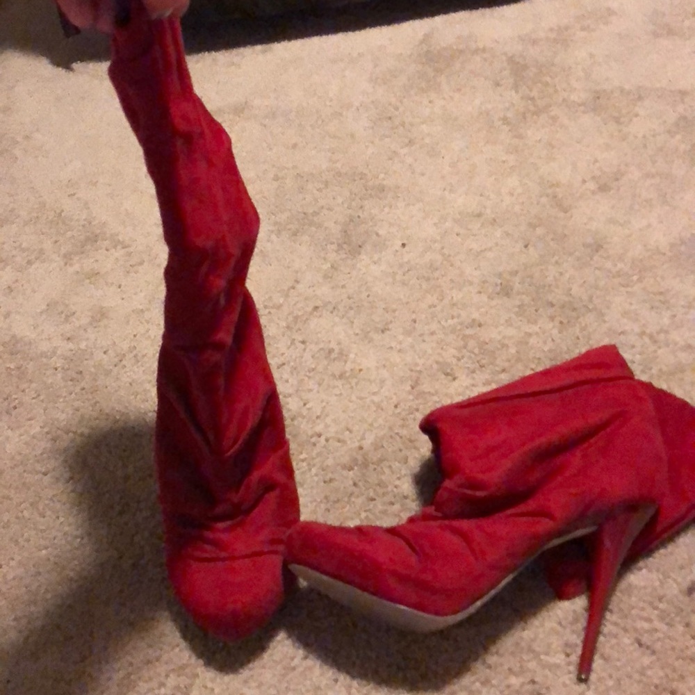 Red high heel boots.